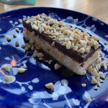 Yellowbelly - Candy Bar, Dark Chocolate, Coconut, Macadamia Nut, Rum Caramel - New American Near Me - St. Louis, Missouri Yellowbelly - Candy Bar, Dark Chocolate, Coconut, Macadamia Nut, Rum Caramel - New American Near Me - St. Louis, Missouri