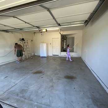 Angel's Paint & Epoxy - Before - stained cement floor with marked and slightly battered walls - Flooring Near Me Angel's Paint & Epoxy - Before - stained cement floor with marked and slightly battered walls - Flooring Near Me