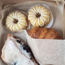 Artisanal Baked Goods - Mini lemon pound cake, blueberry scone, butter croissant, and oatmeal raisin cookies.