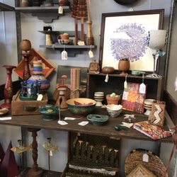 Bohemian Boutique - PS. I bought that art work in the top right corner. It's so unique. Like 100 fisherman or something. Love it!