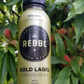 Rebbl - a bottle of gold label on a tree - Health Markets Near Me - Emeryville, California