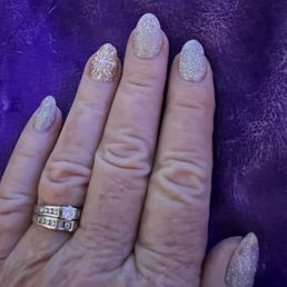 Beautiful example of the work Lee did adding a beautiful design on my ring finger ( gold) and the rest of my fingers in silver.
