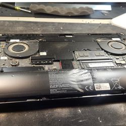Laptop Repair Geeks of DC - See left side for how swollen the battery is!!