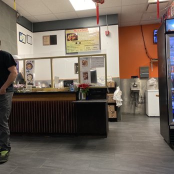 China Cook Express - a man standing in front of a vending machine - Chinese Near Me - Somerdale, New Jersey