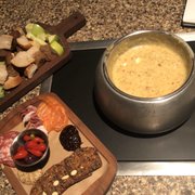 Photo of The Melting Pot - Colorado Springs, CO, United States. Quattro Formaggio cheese fondue with a Charcuterie Board (part of the 4-course experience)
