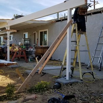 DLR Construction - a man standing on a ladder - General Contractors Near Me - Apple Valley, California DLR Construction - a man standing on a ladder - General Contractors Near Me - Apple Valley, California