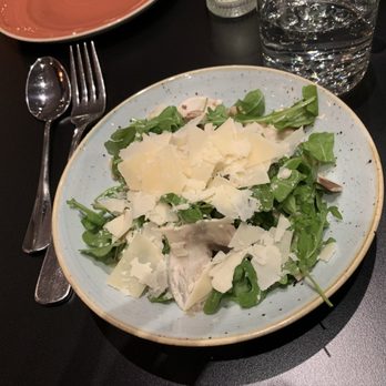 Alta Strada - Wellesley - a plate of salad and a glass of water - Italian Near Me - Wellesley, Massachusetts