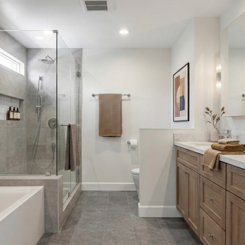 La Vie Interiors - A complete view of this primary suite oasis, blending warm wood tones with cool gray tiles for a perfect warm minimalist vibe. - General Contractors Near Me - San Dimas, California