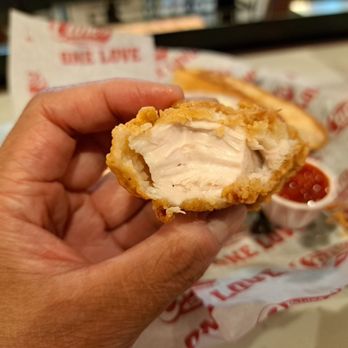 Raising Cane's Chicken Fingers - Inside a chicken finger - Chicken Shop Near Me - Roseville, California Raising Cane's Chicken Fingers - Inside a chicken finger - Chicken Shop Near Me - Roseville, California