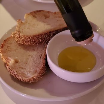 Sullivan Street Bakery - Extra virgin cold pressed olive oil from Chile and the sesame bread Complimentary - Bakeries Near Me - New York, New York Sullivan Street Bakery - Extra virgin cold pressed olive oil from Chile and the sesame bread Complimentary - Bakeries Near Me - New York, New York