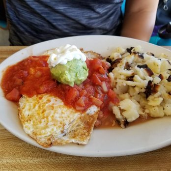 Penguin Cafe - Chilaquilles. Potatoes were okay but got the griddle burnt bits. Palatable nonetheless - Breakfast & Brunch Near Me - Laguna Beach, California