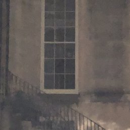 Look at the lower half of the window, right hand side and expand....creepy!