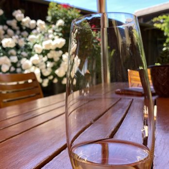 Goldeneye Winery - a glass of wine on a wooden table - Wineries Near Me - Philo, California Goldeneye Winery - a glass of wine on a wooden table - Wineries Near Me - Philo, California