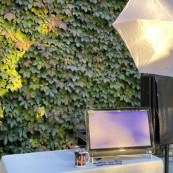 Best Booth Plus - Open air booth with a natural vine wall backdrop