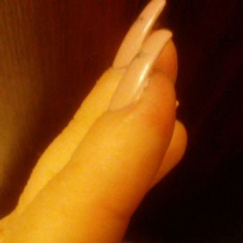 Pro Nails Spa - Real nail hanging out past the acrylic. - Nail Salons Near Me - Cleveland, Ohio