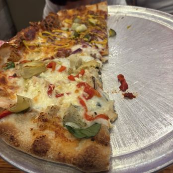 The Heights Pizzeria and Drafthouse - Half and Half Speciaty Pizza featuring 'The Heights' and the 'Cheeseburger' - Chicken Wings Near Me - Harker Heights, Texas The Heights Pizzeria and Drafthouse - Half and Half Speciaty Pizza featuring 'The Heights' and the 'Cheeseburger' - Chicken Wings Near Me - Harker Heights, Texas