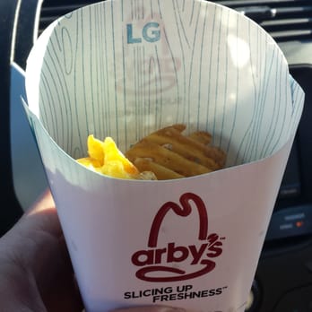 Arby's - a hand holding a cup of french fries - Fast Food Near Me - Warrensburg, Missouri Arby's - a hand holding a cup of french fries - Fast Food Near Me - Warrensburg, Missouri