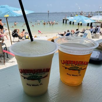 Lagerheads - Refreshing Piña Colada and Beer on the porch looking out to the small beach area. - Bars Near Me - Key West, Florida