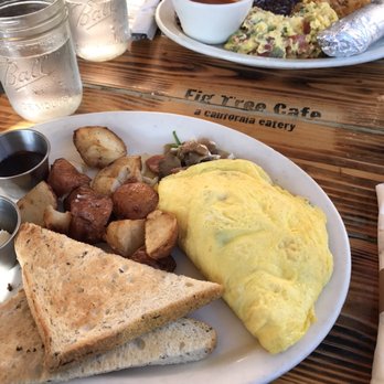 Fig Tree Cafe - Andouille Sausage Omelette with potatoes and rye toast (Monterey scramble in the distance) - Breakfast & Brunch Near Me - San Diego, California Fig Tree Cafe - Andouille Sausage Omelette with potatoes and rye toast (Monterey scramble in the distance) - Breakfast & Brunch Near Me - San Diego, California