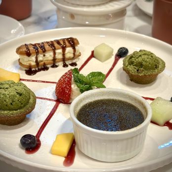 Prince Tea House - Another Trio: Eclair (top), Green Tea Fiancier (middle), and Goma (Black Sesame) Crème Brûlée... - Tea Rooms Near Me - Flushing, New York Prince Tea House - Another Trio: Eclair (top), Green Tea Fiancier (middle), and Goma (Black Sesame) Crème Brûlée... - Tea Rooms Near Me - Flushing, New York