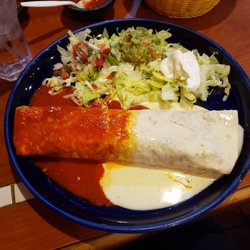 Los Laureles - Grande burrito comes with 1/2 red sauce and 1/2 cheese. Guacamole was also delicious!
