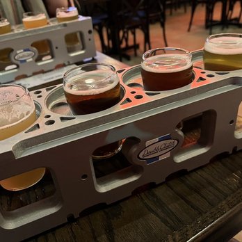 Double Clutch Brewing - Beer flight in cylinder head (?) serving tray - Breweries Near Me - Evanston, Illinois