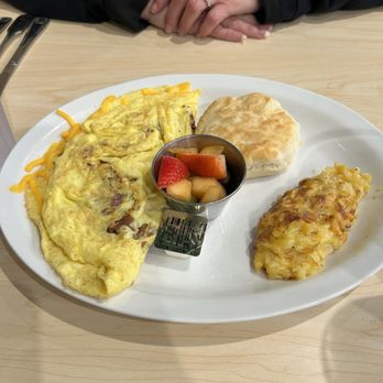 The Toasted Yolk Cafe - Eiffel Tower Omelette with Hash brown Casserole, Biscuit, and Fruit Cup. - Breakfast & Brunch Near Me - Myrtle Beach, South Carolina