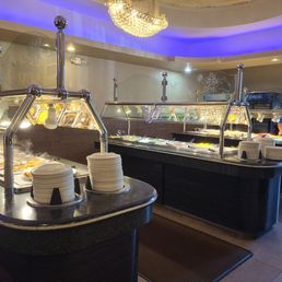 a buffet with a variety of food items a buffet with a variety of food items