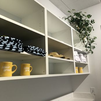 Lekker Eats - a shelf with dishes and mugs - Coffee & Tea Near Me - Myrtle Beach, South Carolina
