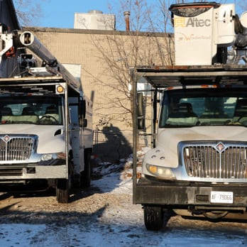 The Weatherhead Group Inc. - two trucks parked in front of a building - Gardeners Near Me The Weatherhead Group Inc. - two trucks parked in front of a building - Gardeners Near Me