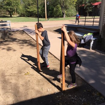 Old Cowtown Museum - Trying out the stilts by the schoolhouse. - Museums Near Me - Wichita, Kansas Old Cowtown Museum - Trying out the stilts by the schoolhouse. - Museums Near Me - Wichita, Kansas