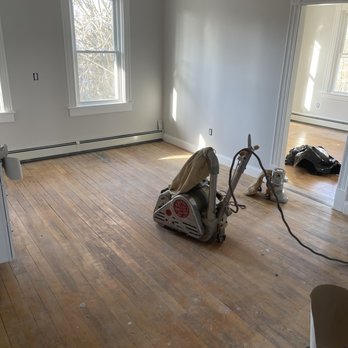 American Builder Hardwood Floor - a hardwood floor being sanded - Flooring Near Me American Builder Hardwood Floor - a hardwood floor being sanded - Flooring Near Me