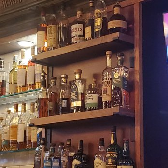 WhiskeyNeat - Bar shelf - Whiskey Bars Near Me - Patchogue, New York