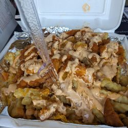 M&Y Boorrito - Look at these delicious buffalo fries from M & Y with their special sauce. They are finger licking good.