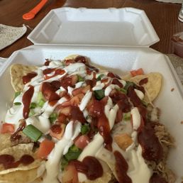Trash can nachos - pulled pork, cheese, sour cream, tomatoes, & added bbque sauce. considered an app and dinner And 2-4 Wed - Sat. 1/2 off.