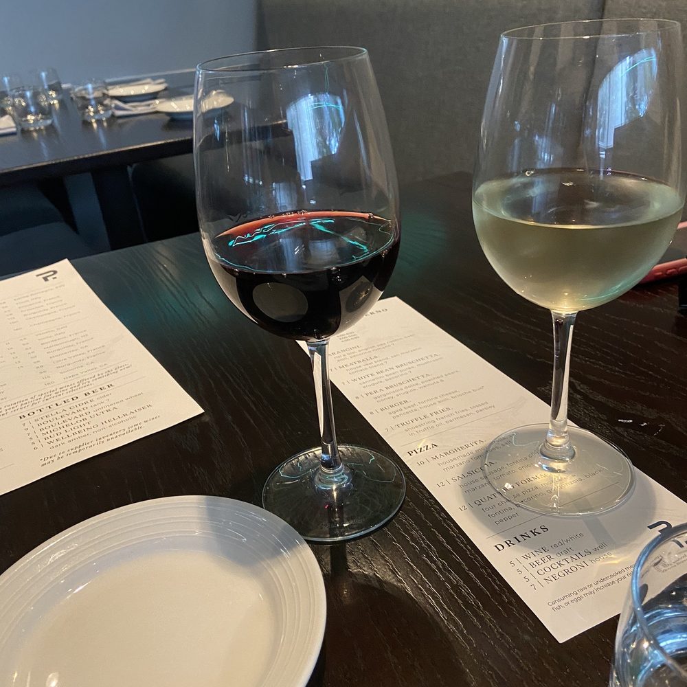 Plate - Cheers! Happy hour wine for $5/glass. Red wine is Chianti and white wine is Pinot Grigio - Italian Near Me - Leawood, Kansas