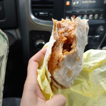 Miguels Jr - Over halfway eaten and finally hit rice.  Tortilla was folded in such a way that a bunch beans were squeezed out of the burrito. - Mexican Near Me - Corona, California