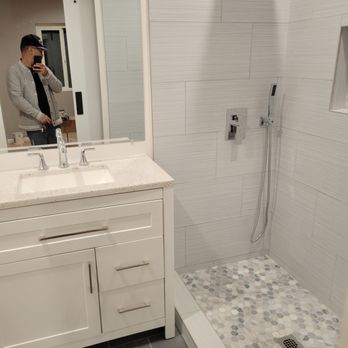 Valley Builders And Remodeling - a man in a bathroom - General Contractors Near Me - Los Angeles, California