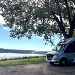 Snake Creek Recreation Area - A Leisure Travel Van Unity at a water side slot at the snake Creek recreation area.