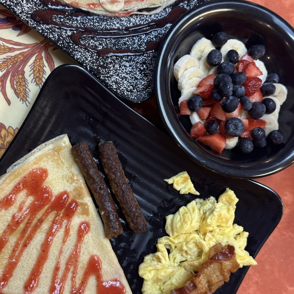 Our Crepes & More - CYO Sweet Crepe, CYO Savory Crepe, 3 Bacon Strips, 3 Sausages, 2 Eggs, Fruit Bowl - Creperies Near Me - Wilmington, North Carolina Our Crepes & More - CYO Sweet Crepe, CYO Savory Crepe, 3 Bacon Strips, 3 Sausages, 2 Eggs, Fruit Bowl - Creperies Near Me - Wilmington, North Carolina