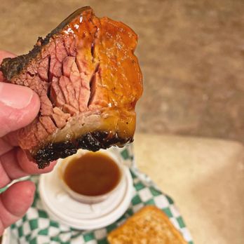 Jazs Bbq - a hand holding a piece of meat - Barbeque Near Me - Gainesville, Texas Jazs Bbq - a hand holding a piece of meat - Barbeque Near Me - Gainesville, Texas