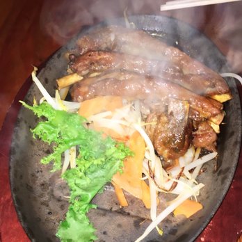 Kenka - BBQ Ribs, pretty good, a little bit on the sweeter tangier side but came out smoking on a bed of vegetables , would prolly order again - Sushi Bars Near Me - New York, New York