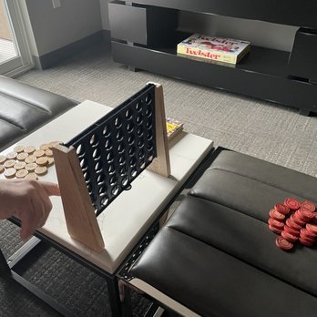 Archer Hotel Burlington - Wooden game in the room. - Hotels Near Me - Burlington, Massachusetts Archer Hotel Burlington - Wooden game in the room. - Hotels Near Me - Burlington, Massachusetts
