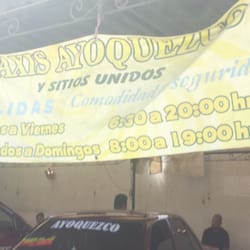 Sitio de Taxis Ayoquezco - Lona con horarios y servicios de los taxis.
