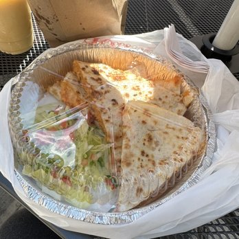 Fresh Stop - a plate of pizza and salad on a table - Dominican Near Me - New York, New York