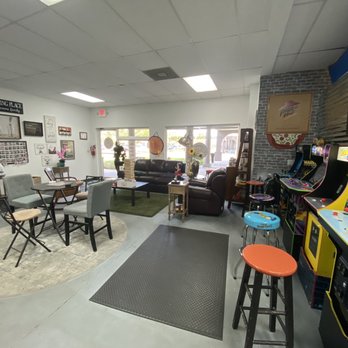 The Axe Hole House - The lobby and arcade games - Axe Throwing Near Me - Davie, Florida The Axe Hole House - The lobby and arcade games - Axe Throwing Near Me - Davie, Florida