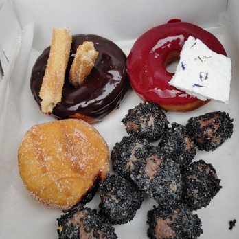 Fan-Fan Doughnuts - Clockwise from top left: Spain (churros and chocolate), La Donna, Sesame Donuts, and Blackberry Red Wine - Donuts Near Me - Brooklyn, New York Fan-Fan Doughnuts - Clockwise from top left: Spain (churros and chocolate), La Donna, Sesame Donuts, and Blackberry Red Wine - Donuts Near Me - Brooklyn, New York