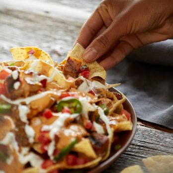 QDOBA Mexican Eats - Nachos can be loaded with grilled adobo chicken, house-made pico de gallo and QDOBA's signature 3-cheese queso, free on any e... - Mexican Near Me - Beloit, Wisconsin QDOBA Mexican Eats - Nachos can be loaded with grilled adobo chicken, house-made pico de gallo and QDOBA's signature 3-cheese queso, free on any e... - Mexican Near Me - Beloit, Wisconsin