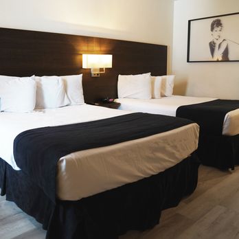 Steam Plant Hotel - Interior of double queen bed room at Steam Plant Hotel Spokane - Hotels Near Me - Spokane, Washington Steam Plant Hotel - Interior of double queen bed room at Steam Plant Hotel Spokane - Hotels Near Me - Spokane, Washington