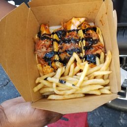 a person holding a box of food a person holding a box of food